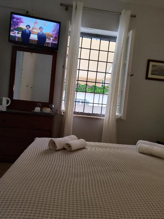 Postel nebo postele na pokoji v ubytování Sidra Hotel