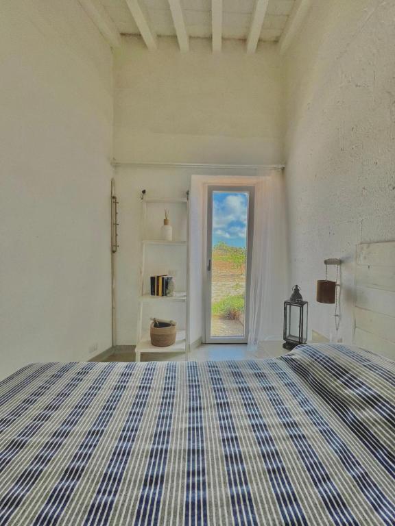 Postel nebo postele na pokoji v ubytování Masseria a libeccio