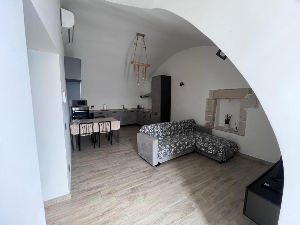 a living room with a couch and a table at BEL VEDERE in Trani
