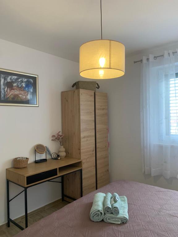 Posteľ alebo postele v izbe v ubytovaní Apartments Panda