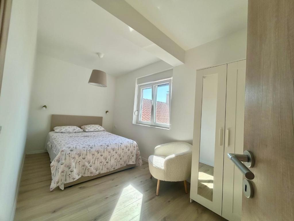 Postel nebo postele na pokoji v ubytování Apartmani Andrea