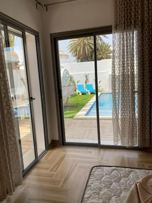 Bazén v ubytování Villa Papaya - Djerba nebo v jeho okolí