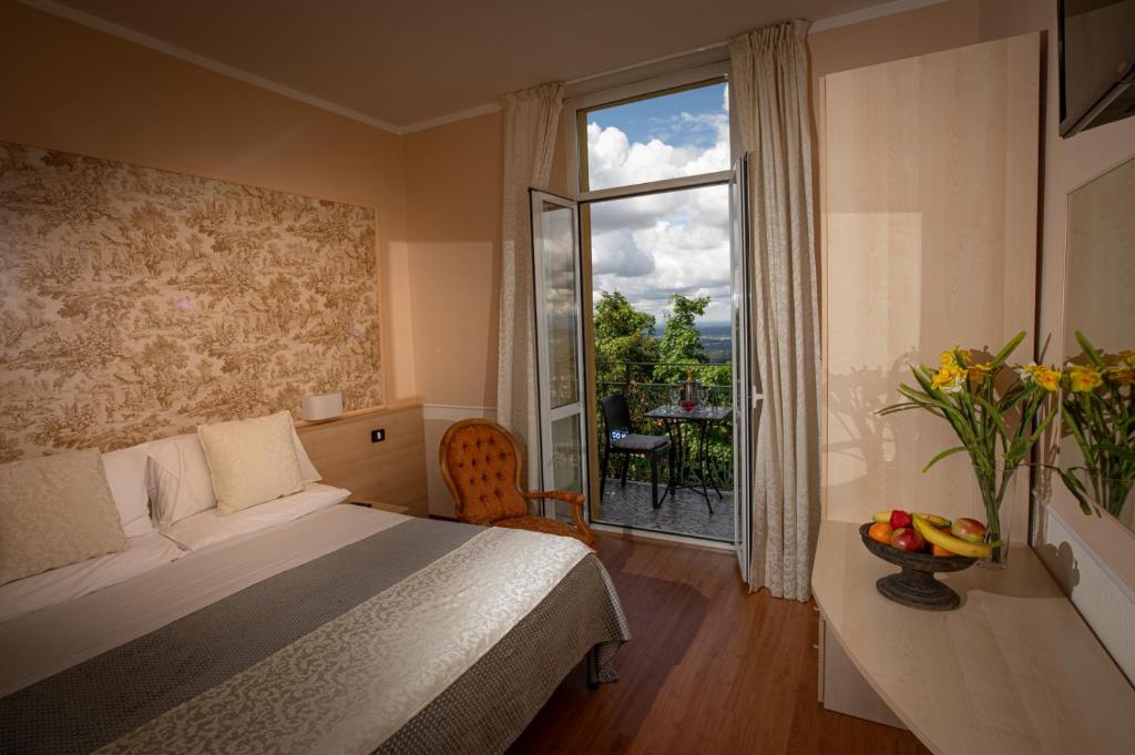 Postel nebo postele na pokoji v ubytování Hotel Vista Lago