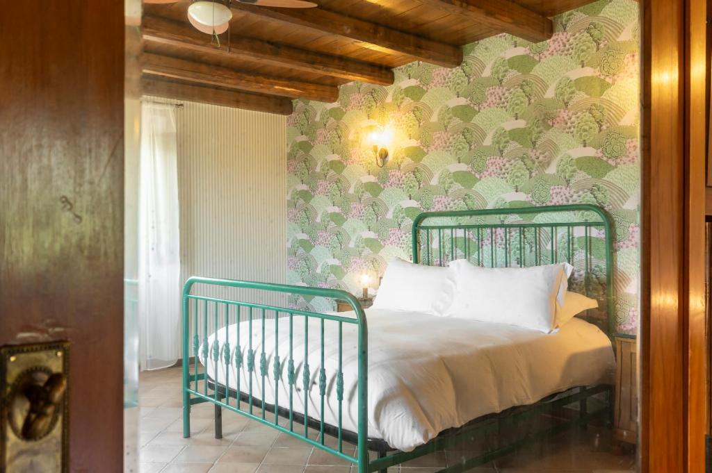 Postel nebo postele na pokoji v ubytování Casale Verdeluna Wine Resort
