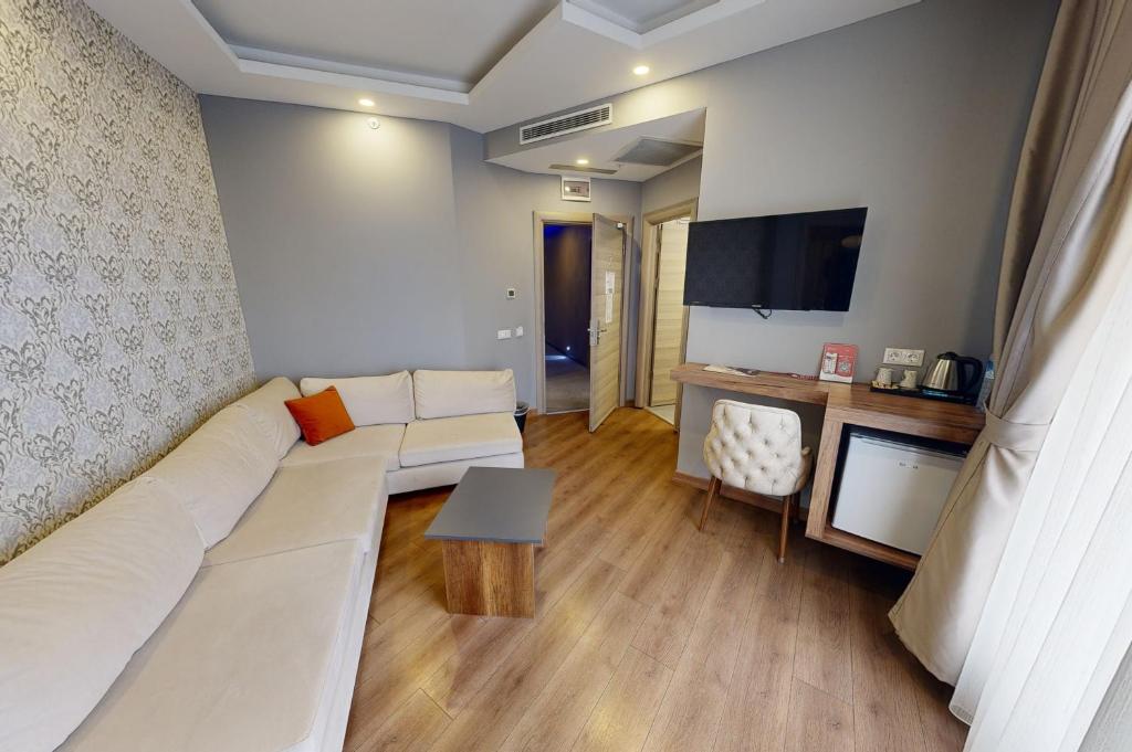 TV a/nebo společenská místnost v ubytování King City Hotel Istanbul Ataturk Airport