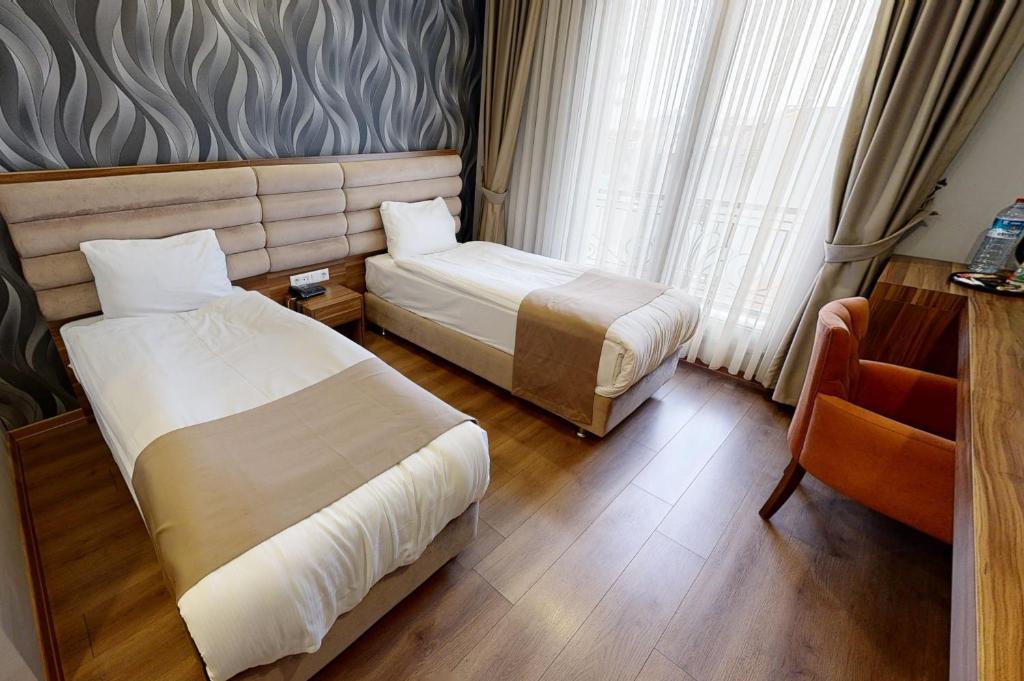 Postel nebo postele na pokoji v ubytování King City Hotel Istanbul Ataturk Airport