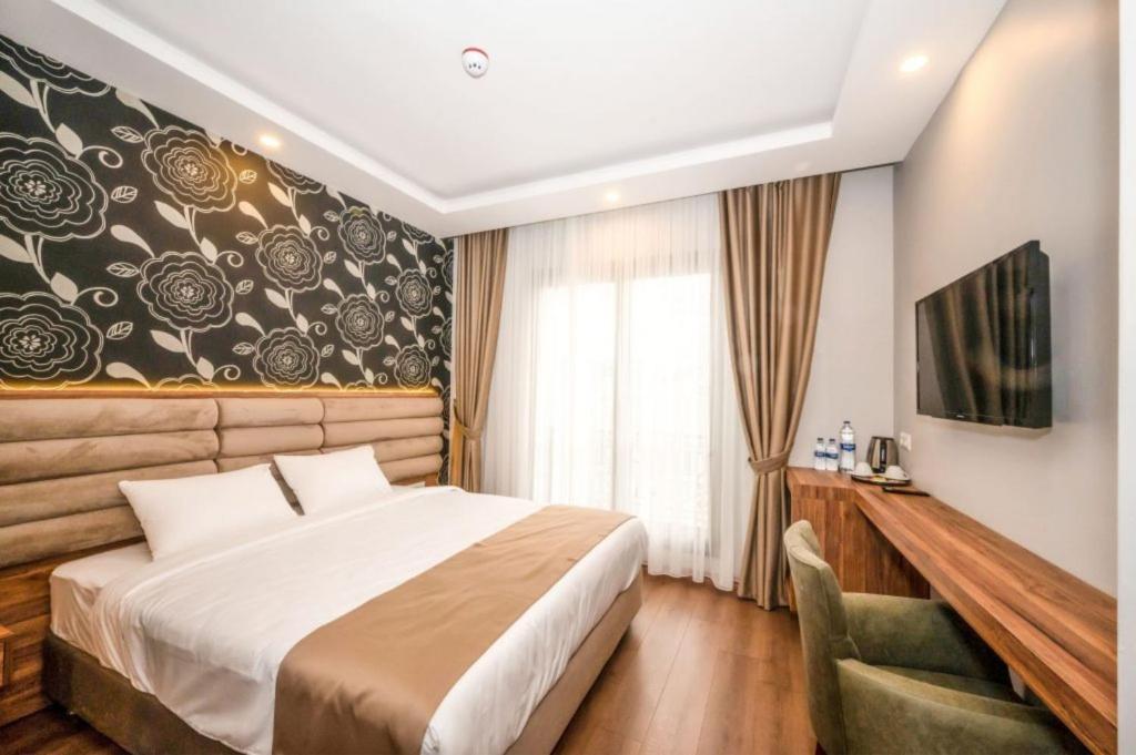 Postel nebo postele na pokoji v ubytování King City Hotel Istanbul Ataturk Airport