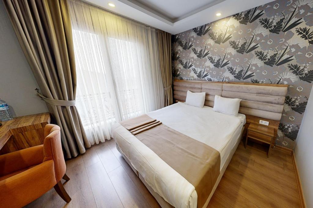Postel nebo postele na pokoji v ubytování King City Hotel Istanbul Ataturk Airport