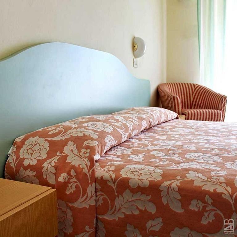 Postel nebo postele na pokoji v ubytování The Match Hotel