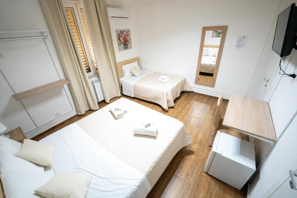 Postel nebo postele na pokoji v ubytování B&B Villa Achibea