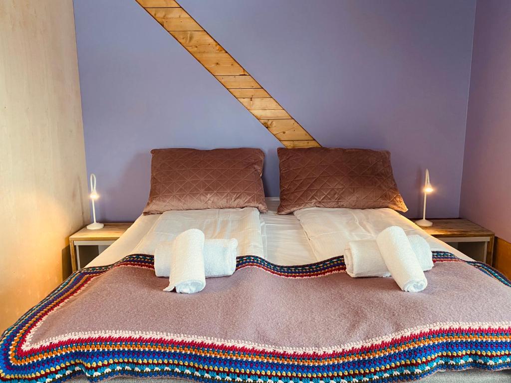 En eller flere senger på et rom på Nøtnes Midnattsol GuestHouse
