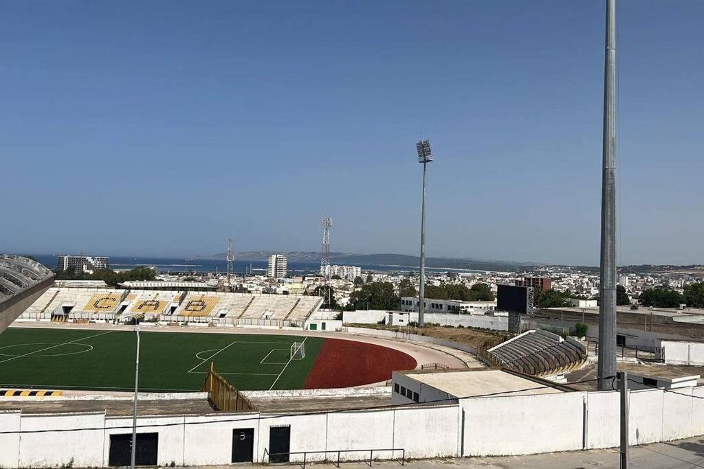 an empty baseball stadium with a baseball field at Spacious two room apartment with a super view in Bizerte