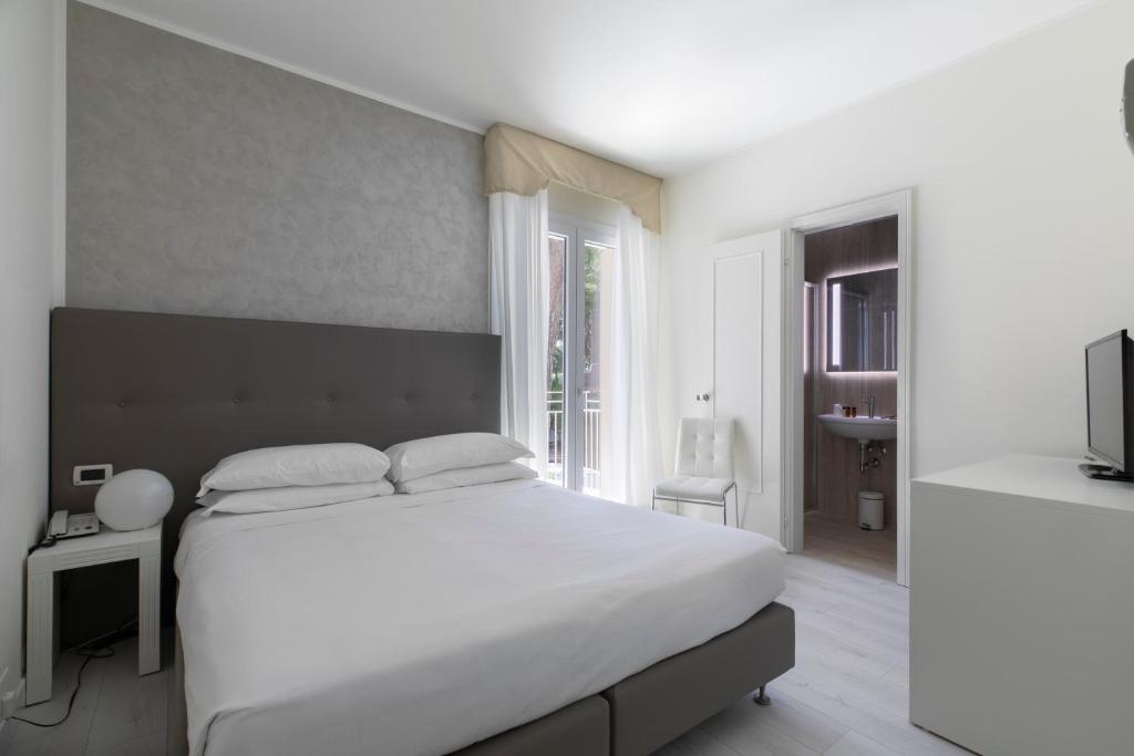 Postel nebo postele na pokoji v ubytování Hotel Gallia & Resort