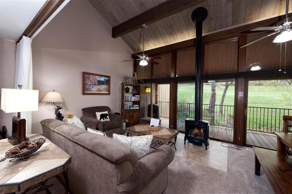 a living room with a couch and a fireplace at Tamarron Gambel Oak 790 - Wild Turkey Ridge - Durango CO in Coffeyville