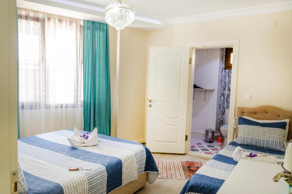 Postel nebo postele na pokoji v ubytování Ephesus Palaces