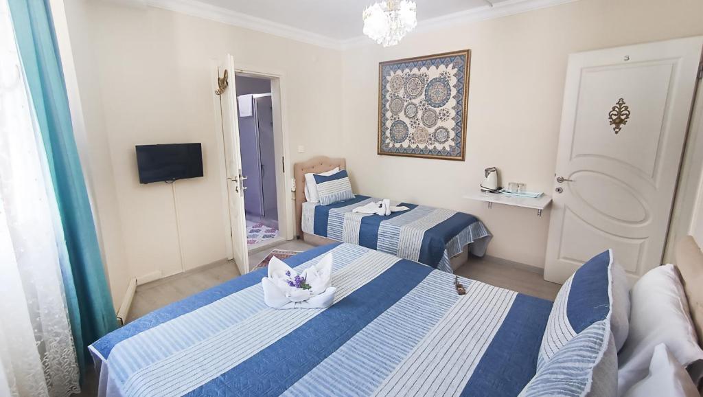 Postel nebo postele na pokoji v ubytování Ephesus Palaces