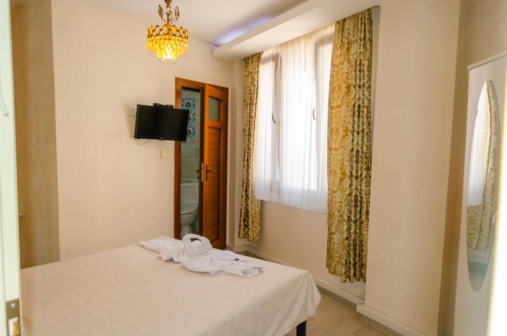 Postel nebo postele na pokoji v ubytování Ephesus Palaces
