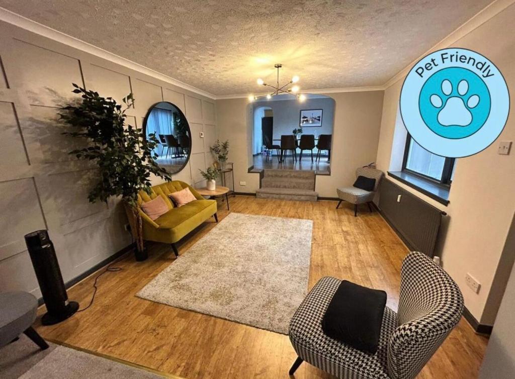 a living room with a couch and chairs in it at Bentinck Residence by Sasco Apartments, Lytham St Annes in Lytham St Annes