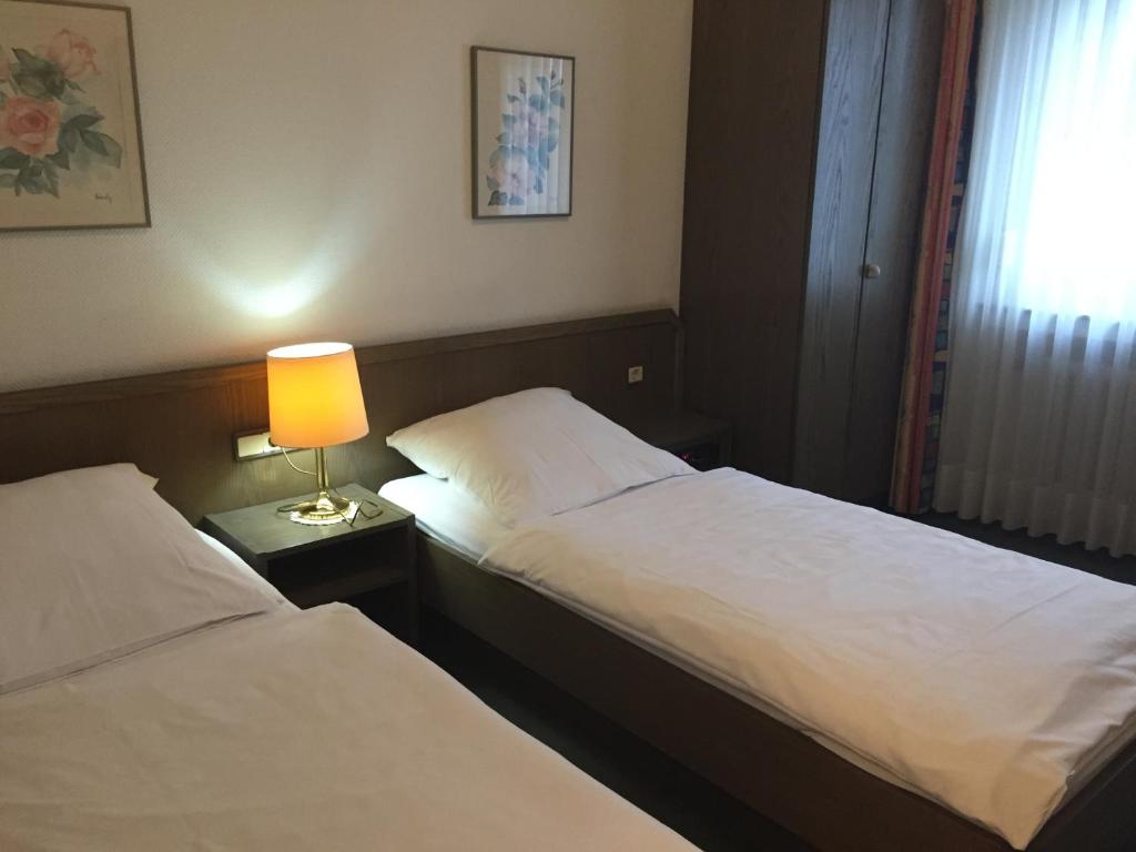 Postel nebo postele na pokoji v ubytování Hotel Görres