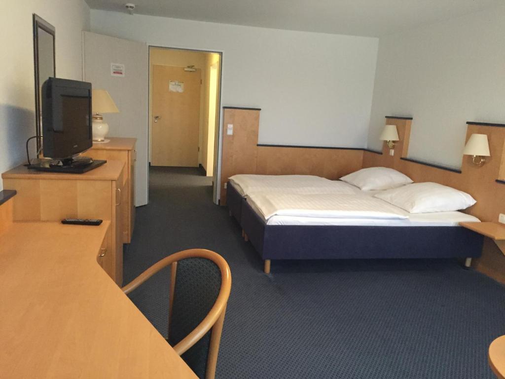 Postel nebo postele na pokoji v ubytování Hotel Görres