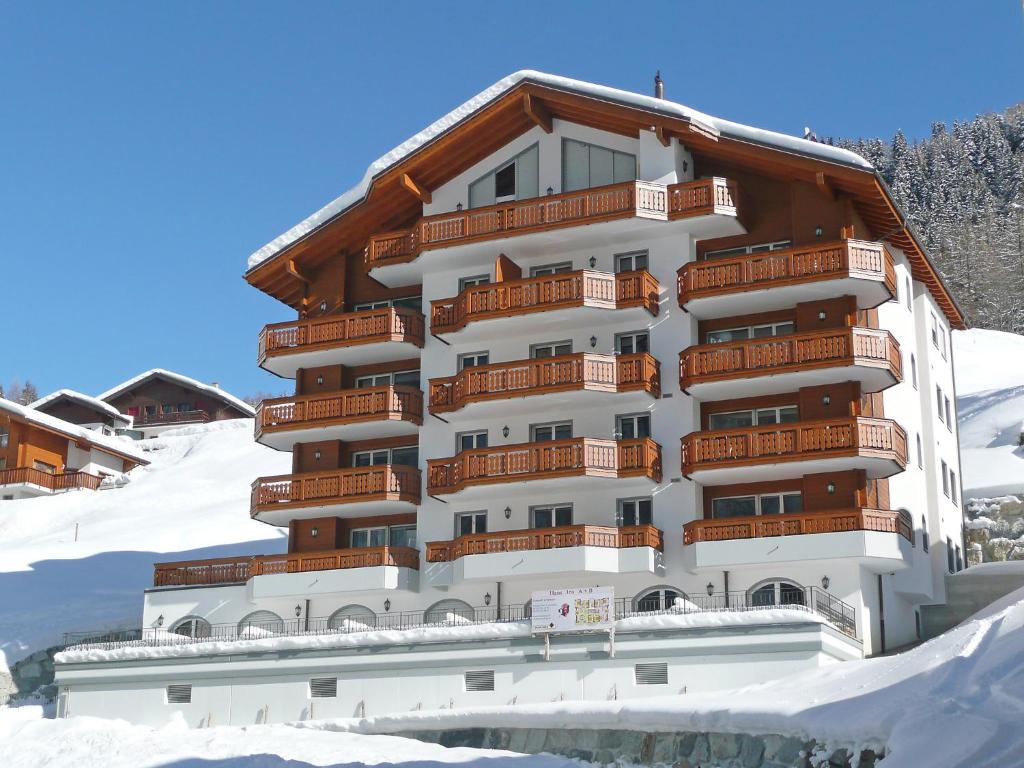 a building with snow in front of it at Apartment B41 by Interhome in Leukerbad
