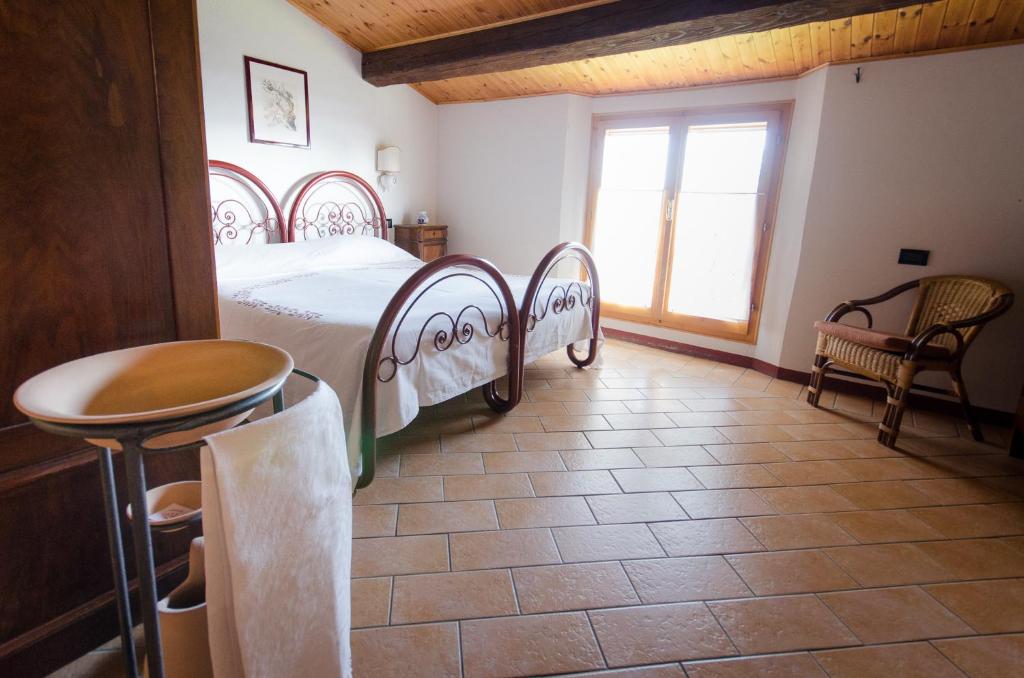 Łóżko lub łóżka w pokoju w obiekcie Agriturismo Ca'de'Gatti