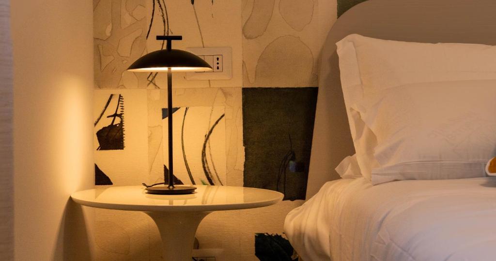 Postel nebo postele na pokoji v ubytování Firrao Rooms Matera