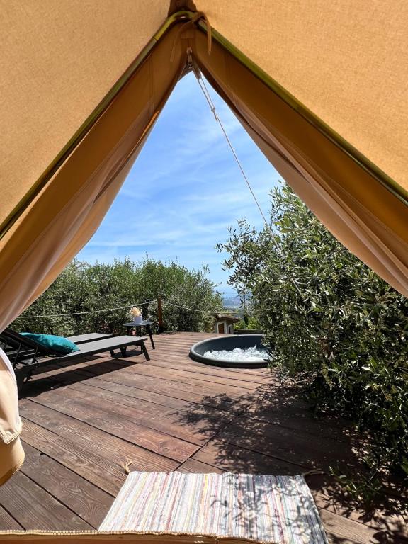 a view from the inside of a tent on a wooden deck at Stecadó Glamping in Dolceacqua