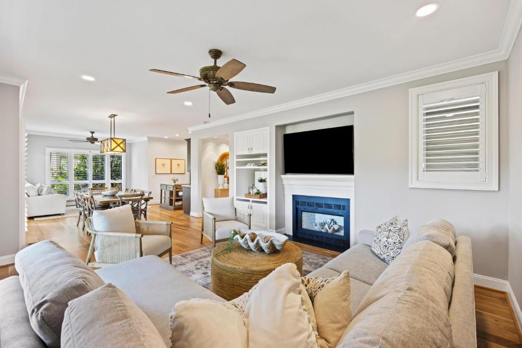 a living room with a couch and a fireplace at 4976 Turtle Point in Kiawah Island