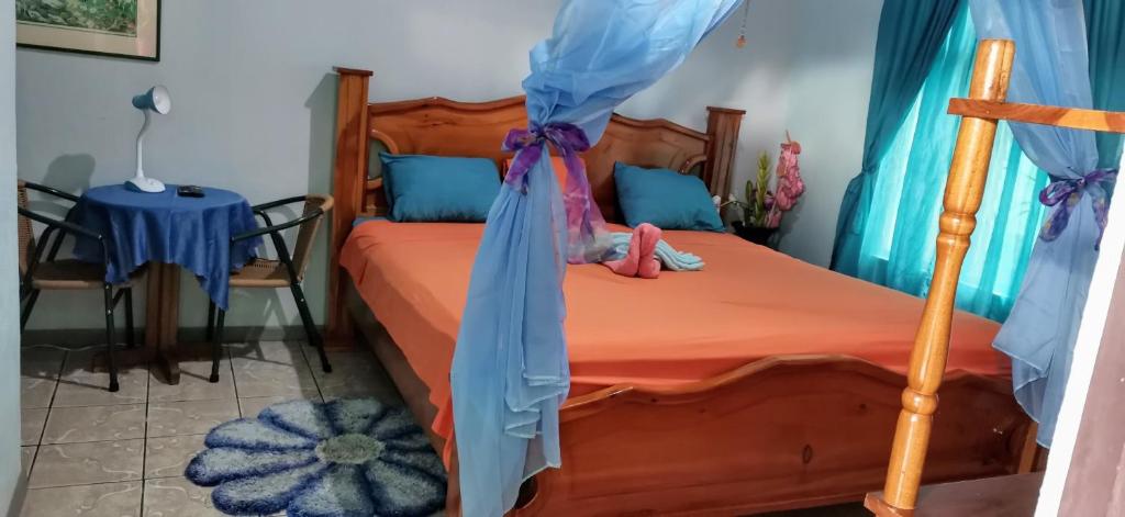 Кровать или кровати в номере Cabinas Mitchaelle's