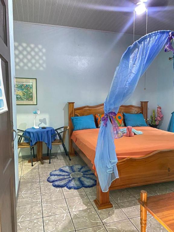 Кровать или кровати в номере Cabinas Mitchaelle's