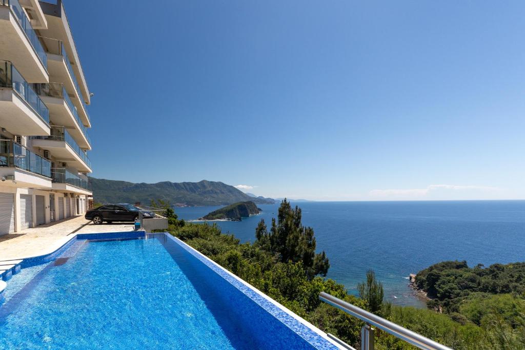 a view of the ocean from a house with a swimming pool at Altezza Premium Tophill best view and pool in Budva