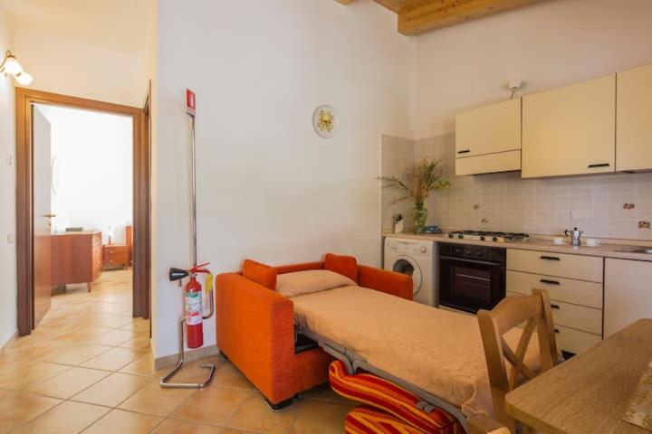 Kuchyň nebo kuchyňský kout v ubytování Casa Vacanze Dalisa Ulivo B con Parcheggio