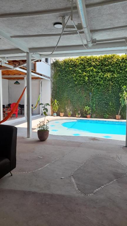 an empty patio with a swimming pool in a building at Managua Inn in Managua