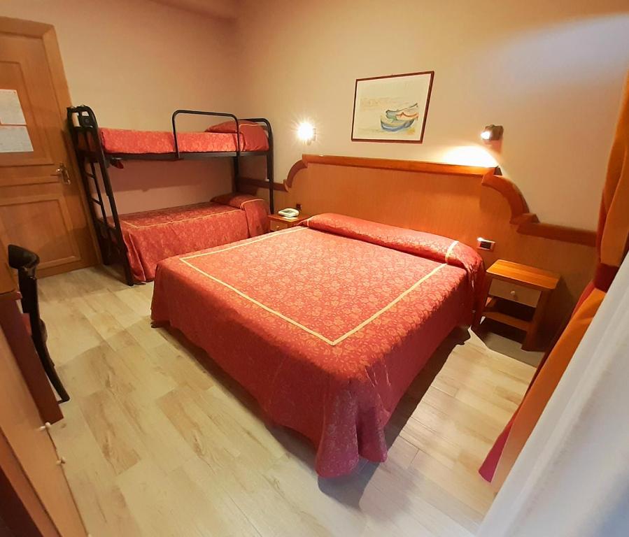 Postel nebo postele na pokoji v ubytování Hotel Promenade