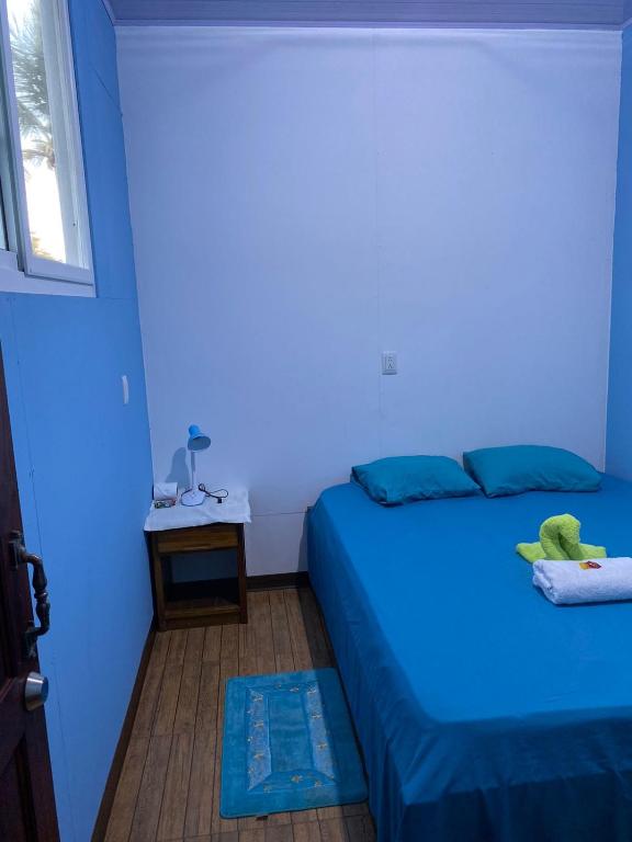 Кровать или кровати в номере Cabinas Mitchaelle's