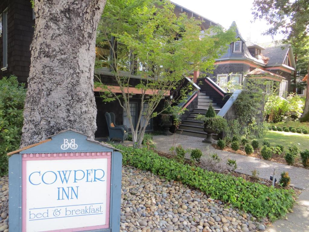 a sign in front of a house at Cowper Inn in Palo Alto
