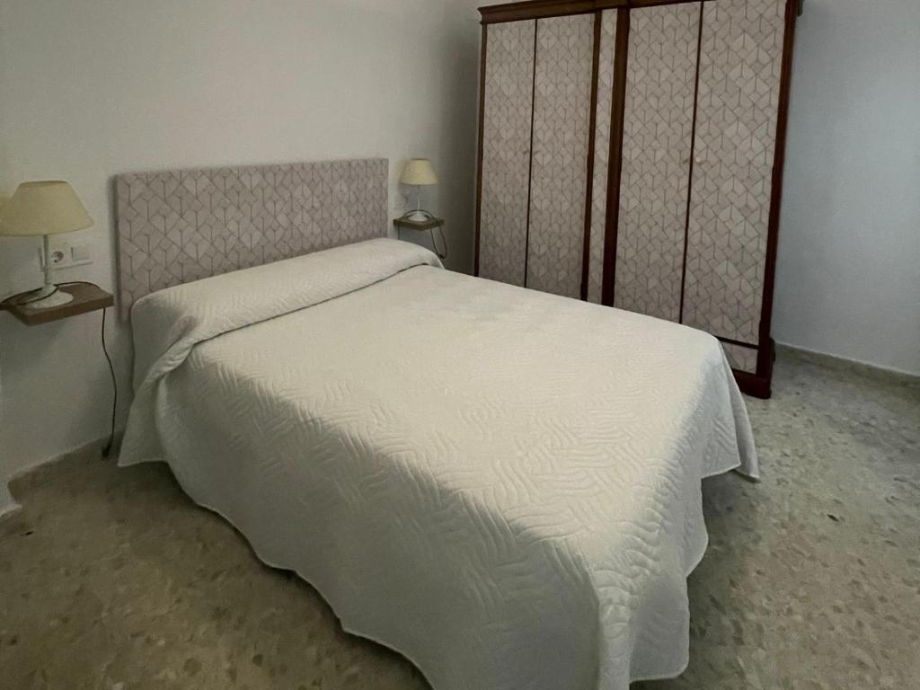 Llit o llits en una habitació de Alojamiento Comercio.