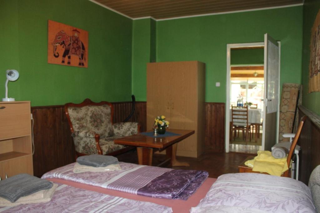 Postel nebo postele na pokoji v ubytování Golden Rose Apartman