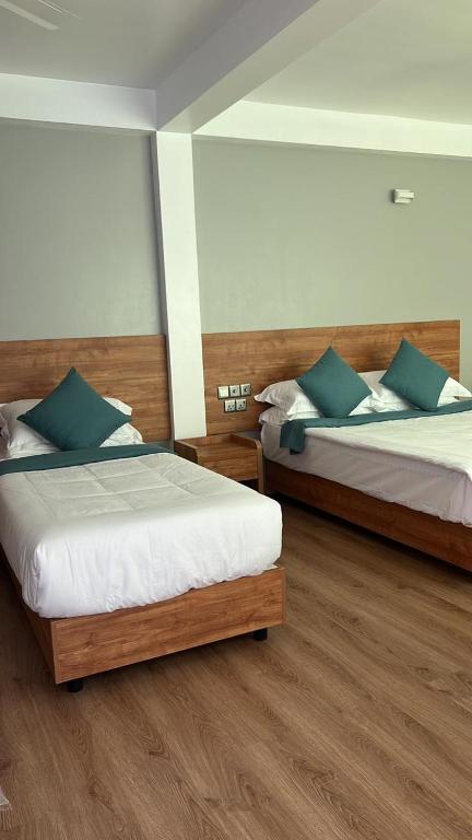 Postel nebo postele na pokoji v ubytování BAGEECHAA STAY