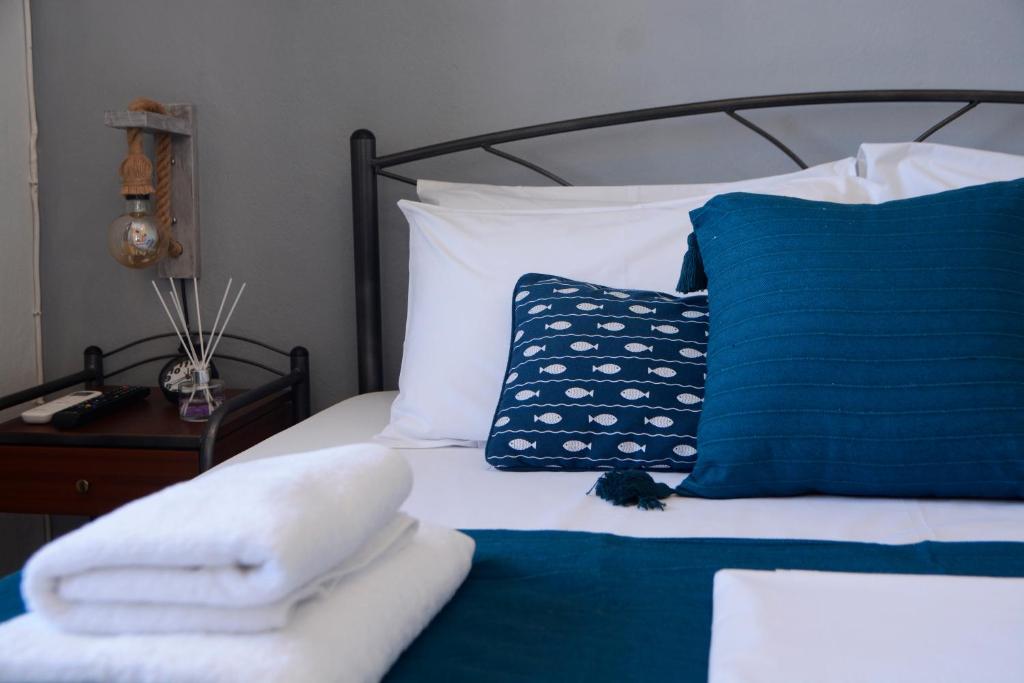 A bed or beds in a room at Batsi Bay Premium