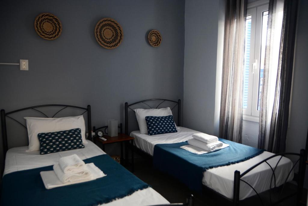 A bed or beds in a room at Batsi Bay Premium