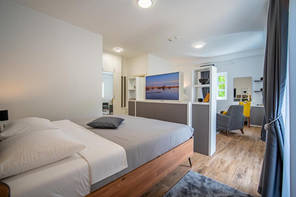 Postel nebo postele na pokoji v ubytování Skala luxury rooms