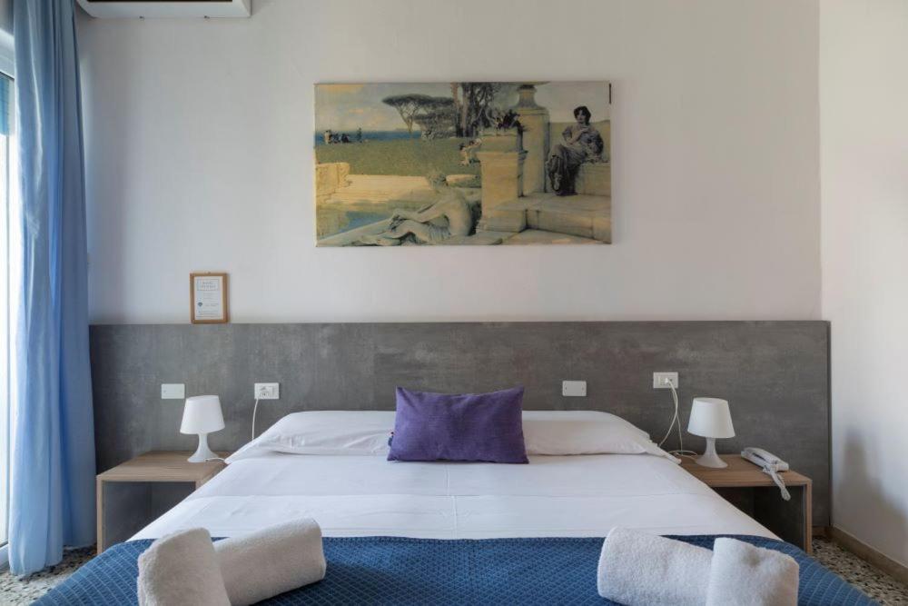 Postel nebo postele na pokoji v ubytování Hotel Danieli