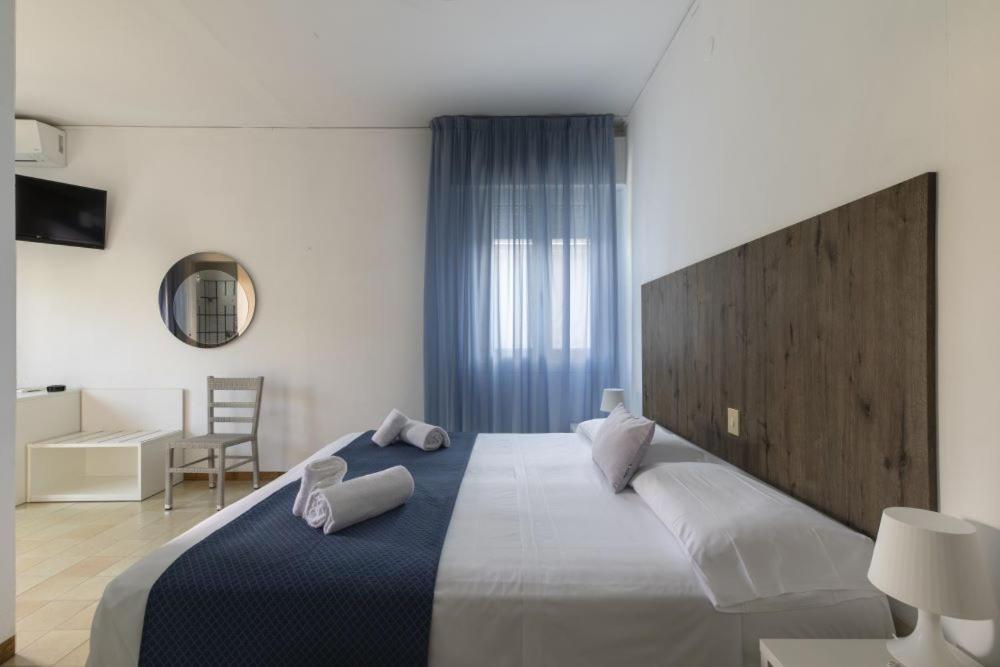 Postel nebo postele na pokoji v ubytování Hotel Danieli