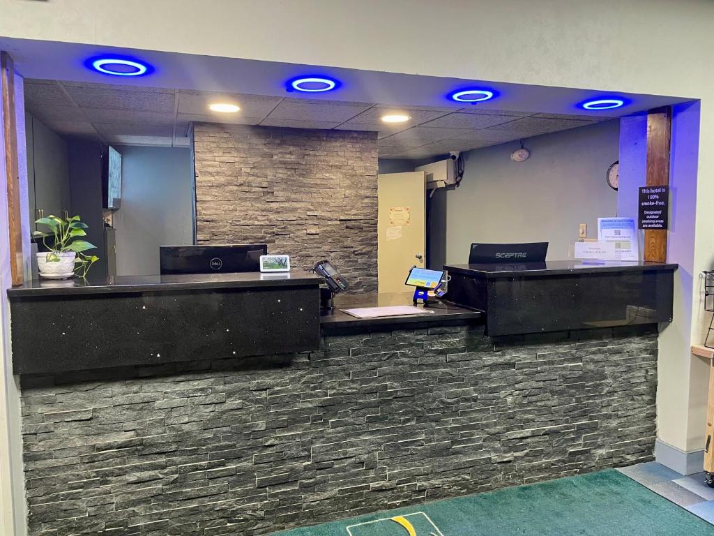 a lobby with blue lights on a stone wall at Quality Inn Conference Center Logansport in Logansport