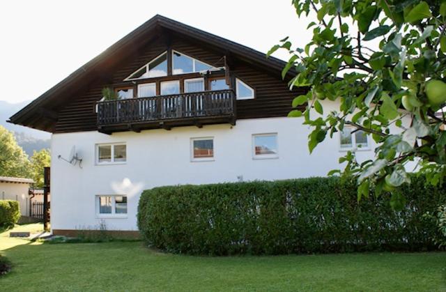 a large white house with a balcony on it at Ferienwohnungen Wentzler in Pflach