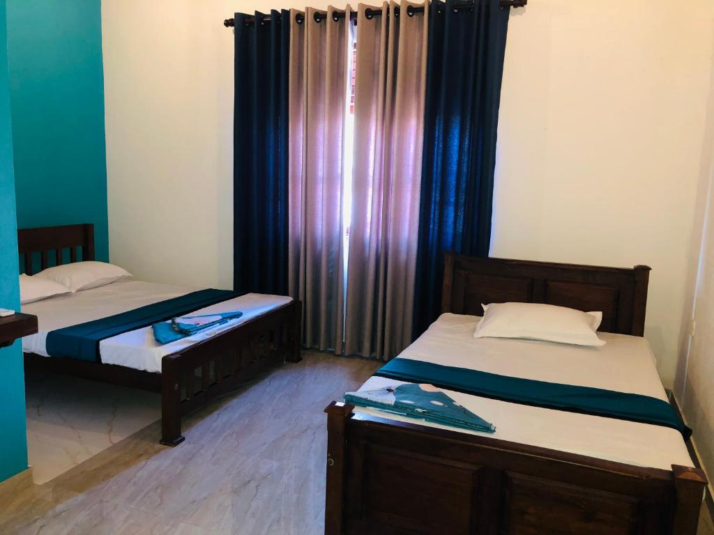 Postel nebo postele na pokoji v ubytování Kottamba Villa Tangalle