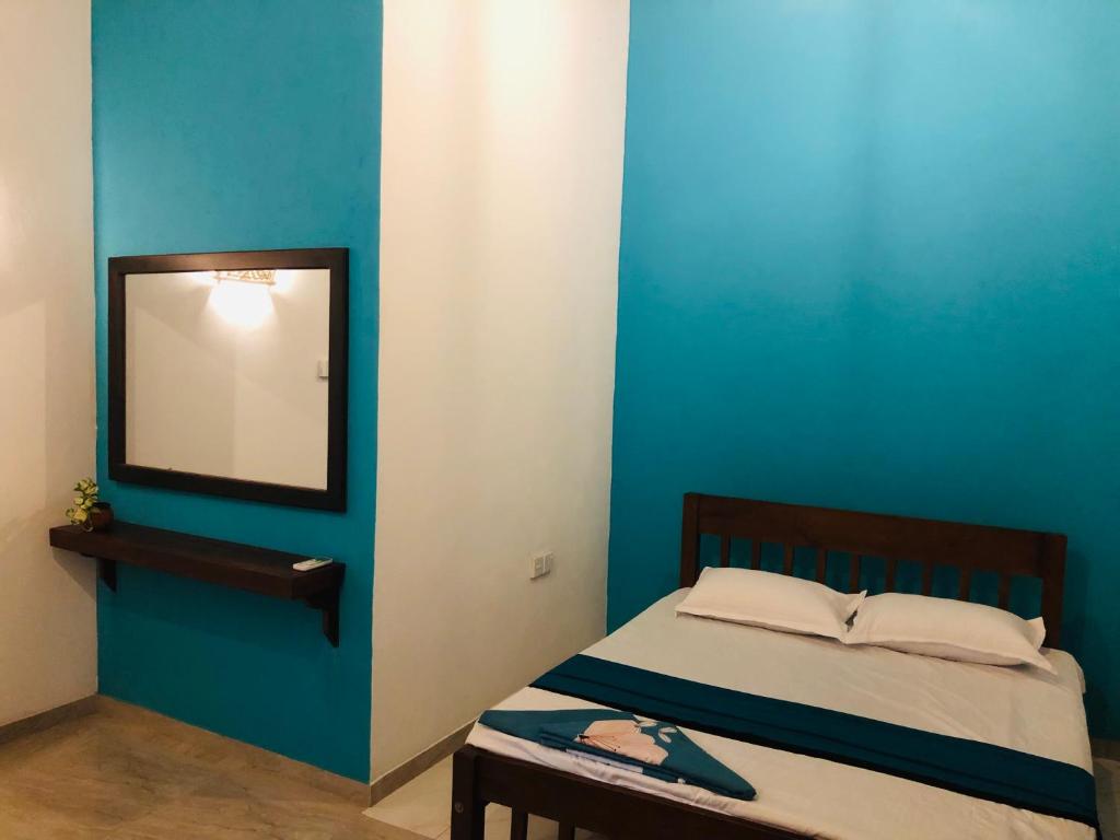 Postel nebo postele na pokoji v ubytování Kottamba Villa Tangalle