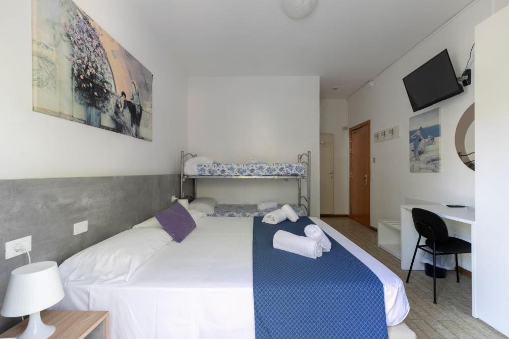 Postel nebo postele na pokoji v ubytování Hotel Danieli